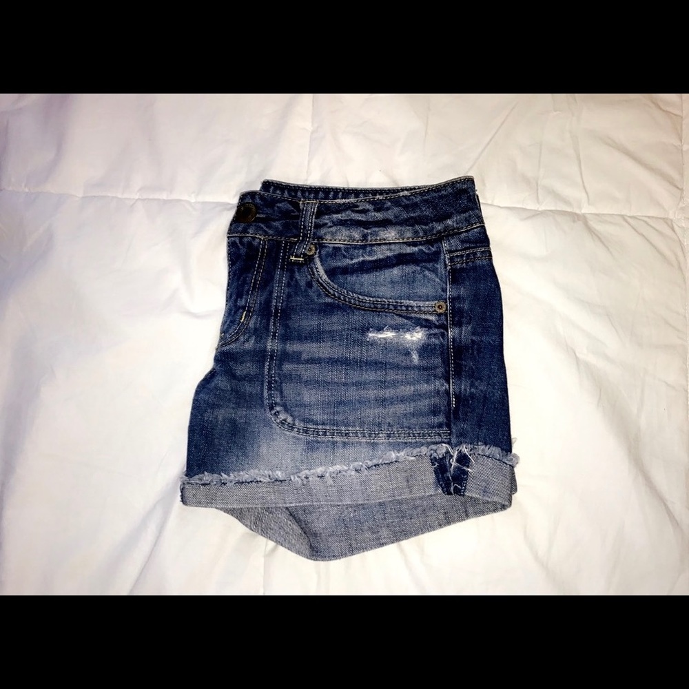 slightly ripped jean shorts.